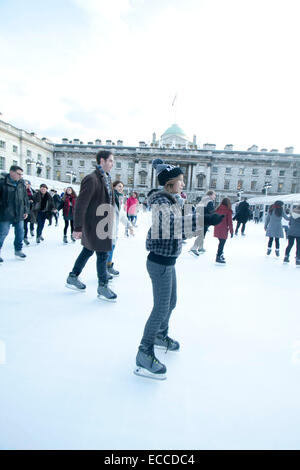 Skaters enjoy the winter weather at Somerset House Ice Rink as snow ...