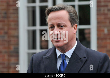 Belfast, Northern Ireland, UK. 11th December, 2014. Prime Minister David Cameron gives a brief statement to the waiting media in Belfast as he arrives for crucial cross-party talks to try to break the stalemate within the Stormont Assembly.  It is believed that if an agreement cannot be met that the Stormont Assembly will collapse. Credit:  Stephen Barnes/Alamy Live News Stock Photo