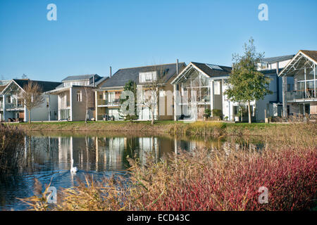 Investment properties / holiday homes beside a lake in the Cotswolds UK, made when gravel pits were exhausted & repurposed Stock Photo