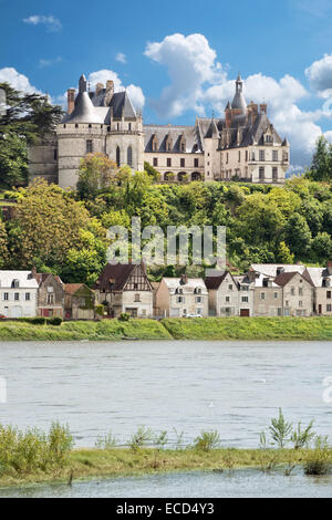 A view of the historic French Château Chaumont with the towns cottages nestled beneath from across the river Loire, France Stock Photo