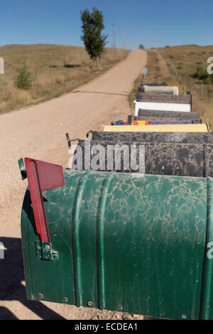 Line of Mailboxes (letterboxes) on Rural Dirt Road, South Dakota, USA Stock Photo