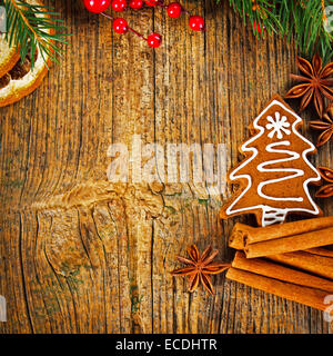 Christmas composition - gingerbread cookie, anise and cinnamon on wooden table Stock Photo