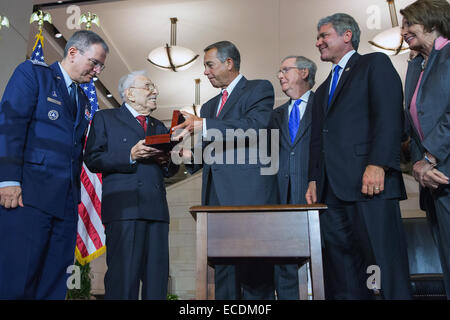 US House Speaker John Boehner present the Congressional Gold Medal to the Civil Air Patrol for service during World War II during a ceremony December 10, 2014 in Washington, DC. From left to right: Major General Joseph R. Vasquez, Former-Congressman Lester L. Wolff, Speaker John Boehner, Senate Minority Leader Mitch McConnell, Representative Michael McCaul, and House Minority Leader Nancy Pelosi. Stock Photo