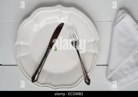 Weight loss new year's concept - single pea on a plate Stock Photo