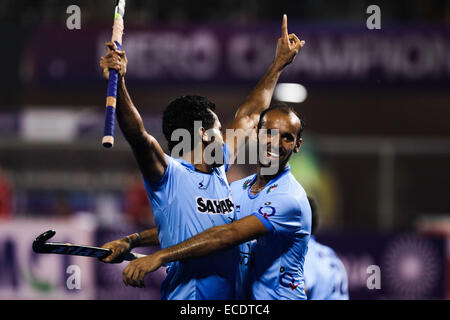 Bhubaneswar, India. 11th Dec, 2014. Indian hockey players Dharamvir Singh (L) and Ramandeep Singh celebrate after scoring during the Hero Hockey Champions Trophy 2014 quarterfinal match against Belgium at the Kalinga Stadium in Bhubaneswar, India, Dec. 11, 2014. India won 4-2. Credit:  Zheng Huansong/Xinhua/Alamy Live News Stock Photo