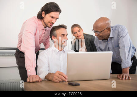 Four business people meeting Brainstorming office Stock Photo