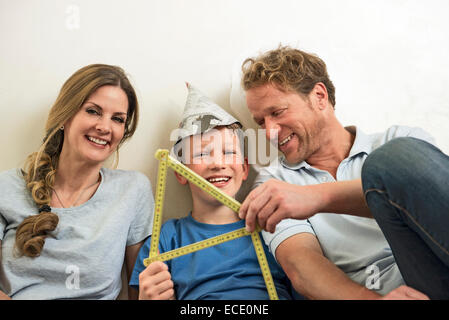 Mother father son together fun happy new home Stock Photo