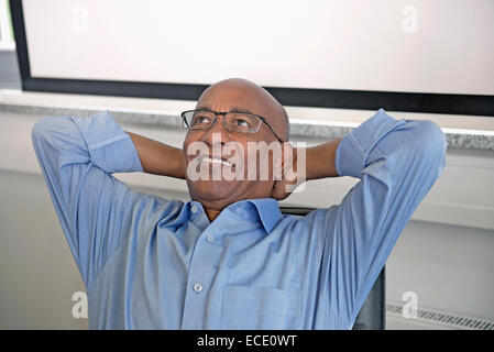 Man African relaxed office smiling happy relaxed Stock Photo