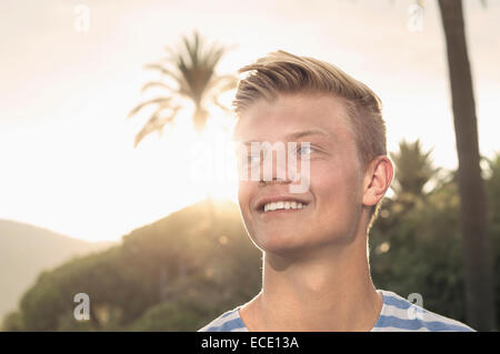 Sunset portrait young teenager smiling holiday Stock Photo