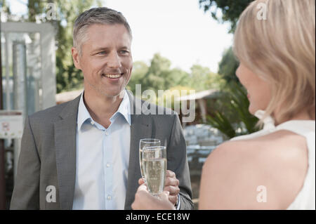 Couple party date attractive champagne toasting Stock Photo