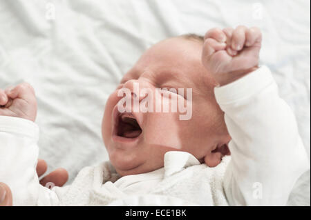 Small baby crying 2 weeks old screaming Stock Photo