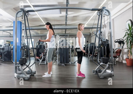 Two young women fitness studio sport practising Stock Photo