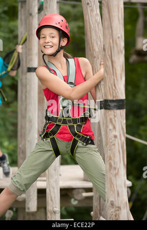 Portrait of girl climbing crag, smiling Stock Photo