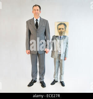 businessman holding hands and standing near boy wearing mask Stock Photo