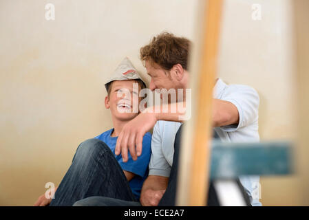 Father son friendship fun together decorating Stock Photo