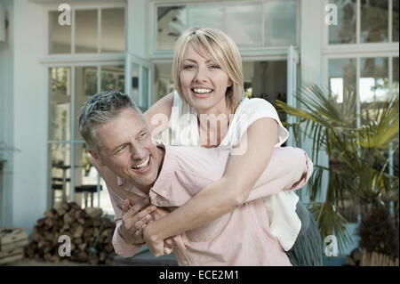 Couple married garden middle aged fun playful Stock Photo