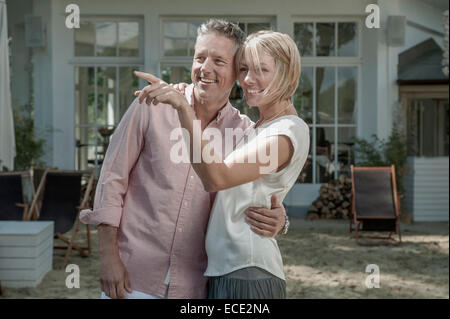 Man Woman pointing garden loving happy Stock Photo
