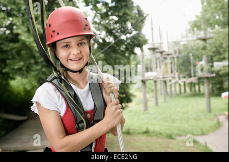 Portrait of girl climbing crag, smiling Stock Photo