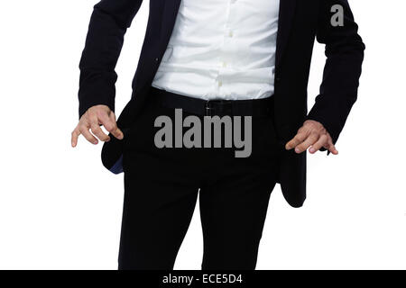 Businessman showing his empty pockets Stock Photo