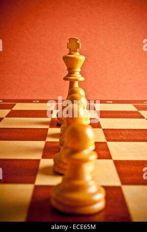 chess king and pawns, concept for teamwork and cooperation Stock Photo