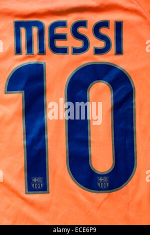 Messi 10 on orange coloured football shirt Stock Photo