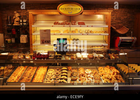 The Backstube Lech in Lech, Austria. Pastries and cakes are displayed in the cabinet. Stock Photo