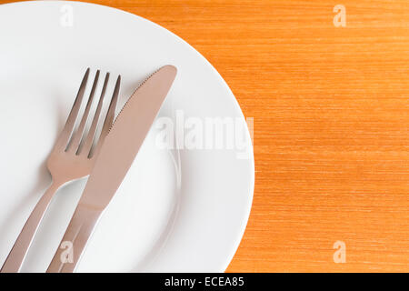 White place setting on wooden table Stock Photo