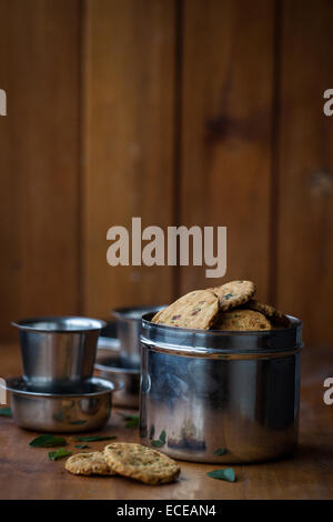 Close-up of a tin of home made savoury crackers Stock Photo