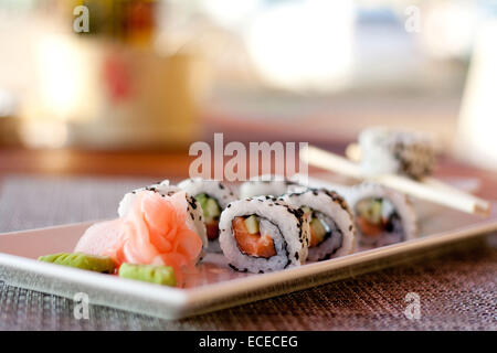 Japanese seafood sushi, roll and chopstick on white plate Stock Photo