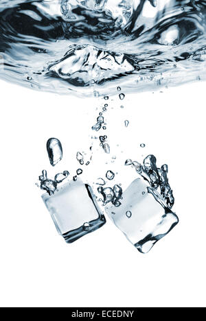 ice cubes dropped into water with splash isolated on white Stock Photo ...