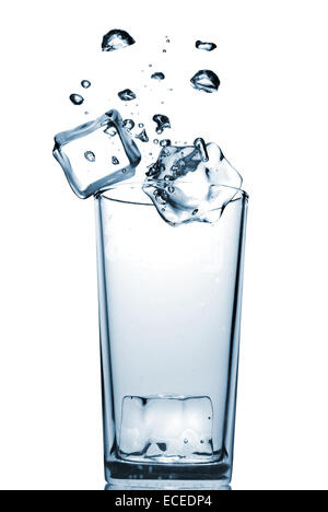 ice cubes dropped into glass with bubbles isolated on white Stock Photo ...