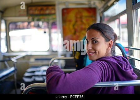 Young woman inside a bus in Sri Lanka Stock Photo