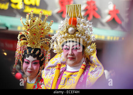 Chinese actors in traditional costume take part in a Lunar New Year Chinatown parade Stock Photo