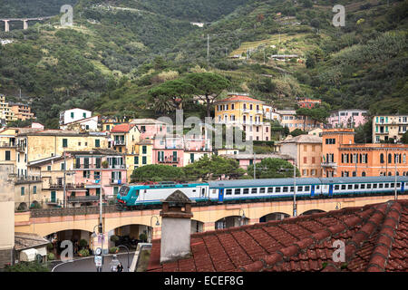 The train travelling through Cinque Terre in the town of Monterosso al Mare, Italy. Stock Photo