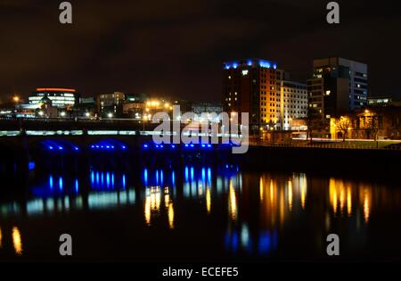 Reflections on the river from Glasgow Bridge and Clyde Street in Glasgow, Scotland at night Stock Photo