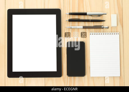 Tablet PC and smart phone with school office supplies on wooden background Stock Photo