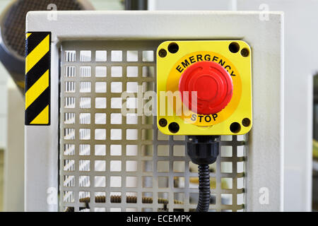 red emergency stop push button on engine close up Stock Photo