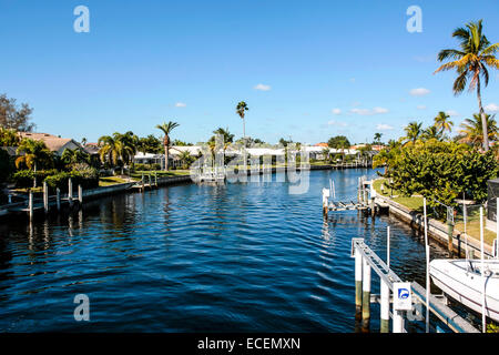 Residential properties with boat lifts and landings in the waterways of Punta Gorda Island, Florida Stock Photo