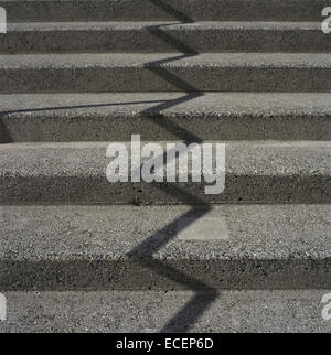 Zig zag shadow on a concrete staircase Stock Photo