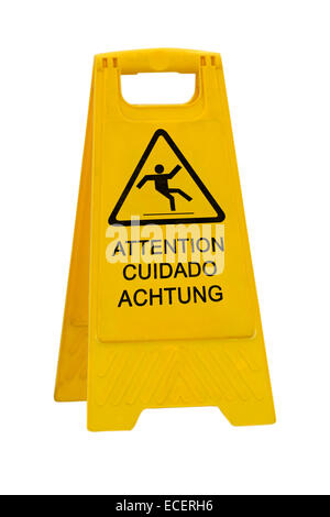 Yellow Caution slippery wet floor sign labeled in English/French, Spanish and German Language isolated on white background Stock Photo