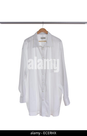 White shirt on a wooden hanger isolated on white background Stock Photo