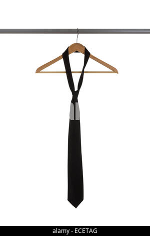 Black tie on a wooden hanger isolated on white background Stock Photo