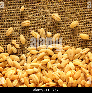 Pearl barley on sacking background Stock Photo