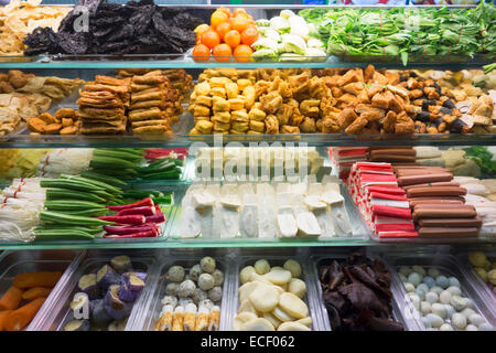 Ingredients for a delicious Yong Tau Foo Chinese meal of fish paste stuffed into vegetables and tofu with hot spicy soup broth Stock Photo