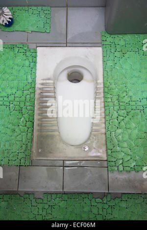 Old style Chinese seatless toilet in Asia Stock Photo