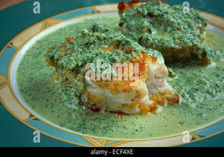 Merluza en salsa verde - fried fish with green sauce Stock Photo