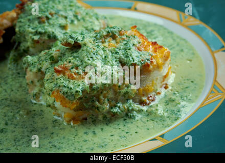 Merluza en salsa verde - fried fish with green sauce Stock Photo