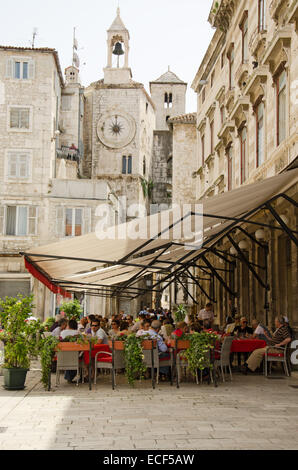 SPLIT, CROATIA - MAY 19, 2013: people are taking a brake in one of the street cafe in Split. On May 19, 2013, in Split, Croatia Stock Photo