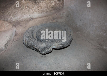 Milling stone in the underground city Kaymakli Stock Photo