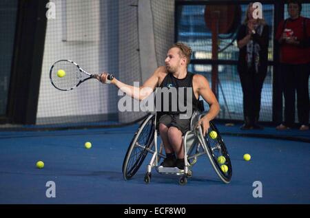 Melbourne, Australia. 12th Dec, 2014. World number two wheelchair tennis player Dylan Alcott hits a return during his 24-hour wheelchair tennis marathon to raise money for charity in Melbourne, Australia, Dec. 12, 2014. Credit:  Bai Xue/Xinhua/Alamy Live News Stock Photo